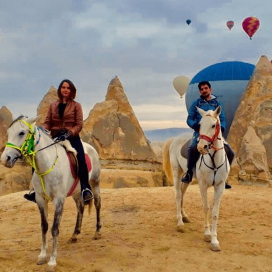 Cappadocia: Horse Riding with Balloons Above at Sunrise